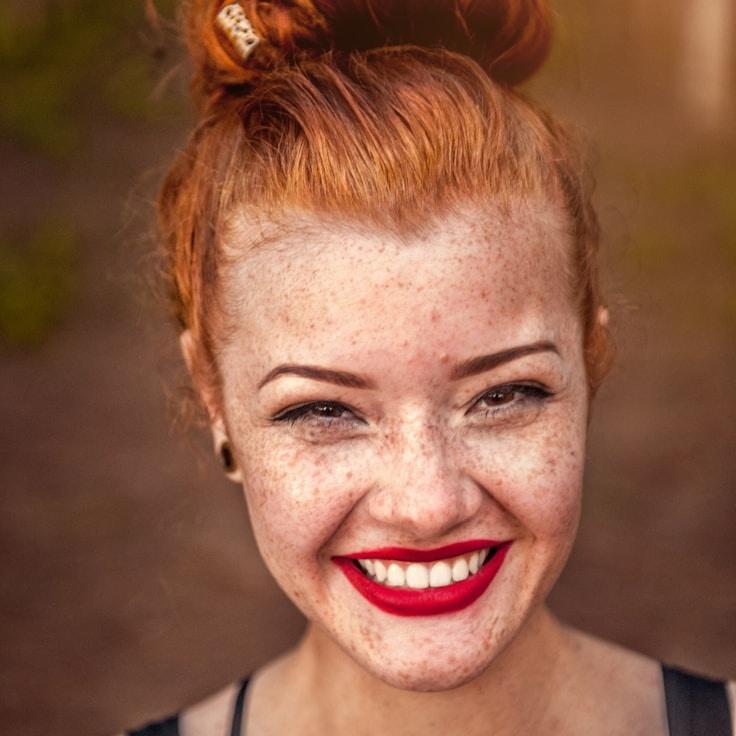 Kaveri Mehta, Lead Design Curator at Clear Path Community, reviewing corporate floral arrangements